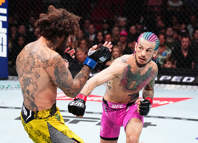 (R-L) Sean O'Malley punches Marlon Vera in the UFC bantamweight championship fight during the UFC 299