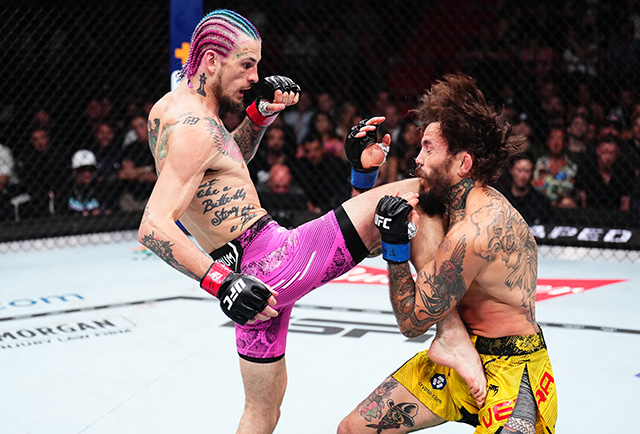 (L-R) Sean O'Malley knees Marlon Vera in the UFC bantamweight championship fight during the UFC 299